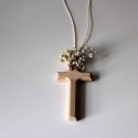 Natural wooden cross with flowers