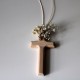 Natural wooden cross with flowers