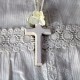 Ivory wooden cross with flowers