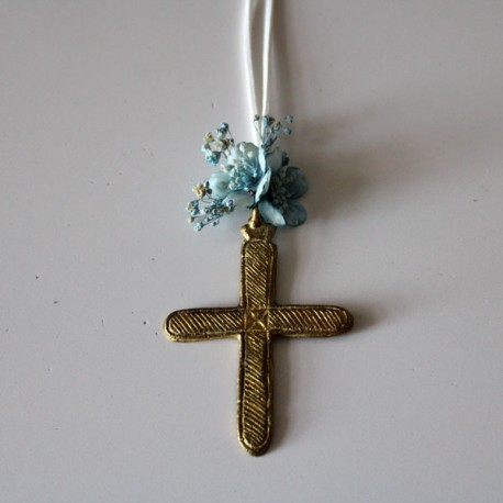 Metal golden cross with blue flowers