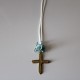 Metal golden cross with blue flowers