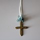 Metal golden cross with blue flowers