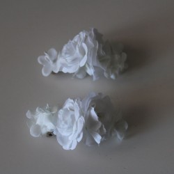 Two white flower clips for communion