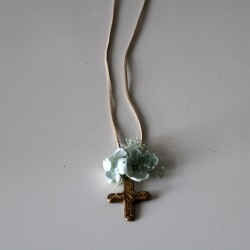 Small metal golden cross with green flowers