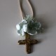 Small metal golden cross with green flowers